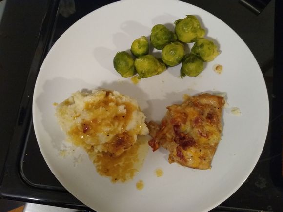 Marinated chicken, baked with ranch dressing and topped with cheese and bacon, plus mashed taters and veggies.