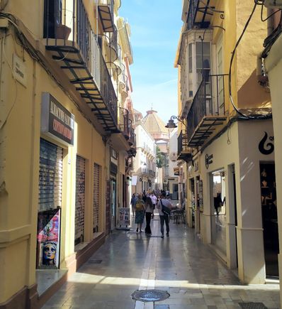 An alleyway in Málaga, where the underlying stonework can be quite slippery 