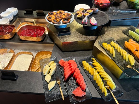 Fruit, yogurt and pastis de nata 