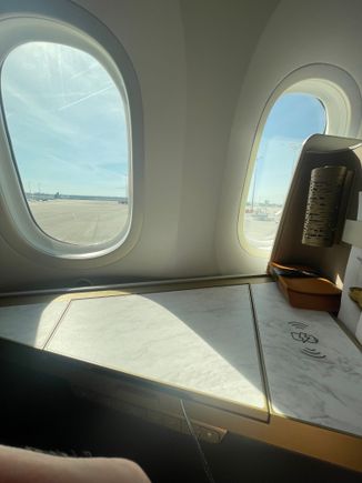 Row 8, you see 2nd window is at the back of the seat. Same for 7 