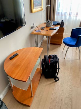 The rooms are clearly renovated, but the furnishings, while looking brand new, are super clearly 90s design. Like, look at the TV stand!