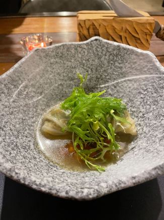 Cabbage rolls with local mushrooms in a chicken consomme