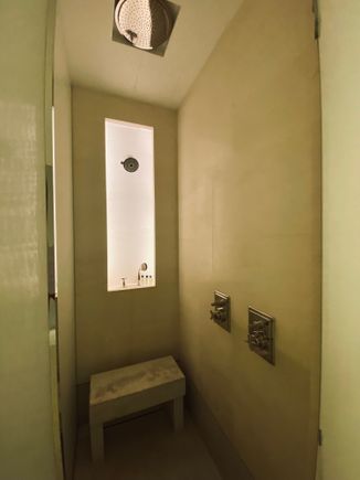 Small shower with three shower heads 