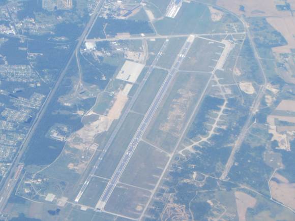 Saw this nice airport from the air and took a photo. No clue where it is! Anyone??