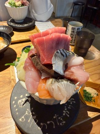 A plentiful bowl of fish donburi with a side of fish head soup (out of shot)