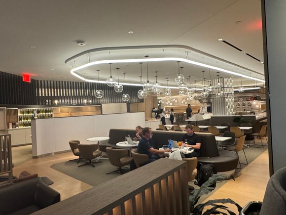 I am currently here in the lounge. It’s fine. Definitely up to LH standard, pleasant. The Polaris lounge might be a bit nicer, but not worth the trip over there, especially at peak times.