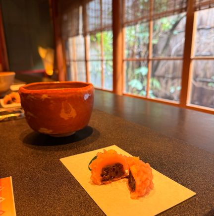 Tea house. Hot matcha drink and red bean sweet.