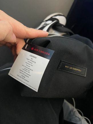 Wants Les Essentiels amenity kit, blanket and pillow + seat cover.

