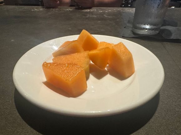At one of my normal haunts.  Staff was eating watermelon.  In discussion I said I’m not big on watermelon but love cantaloupe.   So this showed up in front of me.   They know I’ve got their back so they take care of me.  