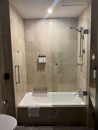 Shower that had mediocre water pressure, but also managed to spray water everywhere