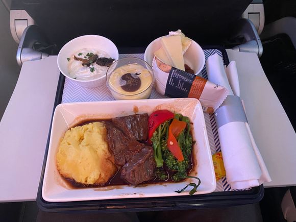 CFU/LHR  today. No menus. Beef Cheeks for him. His starter was a rather nice coleslaw type effort which I ate. He liked the main - very tasty he said. Then it was Cherry trifle, which I also had and that was nice. 