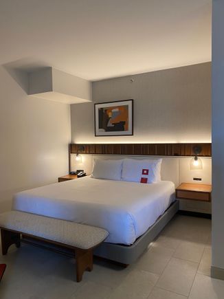 Palm Suite bed. Note: there is no door separating the living room from the bed area, which are roughly in an “L” shape
