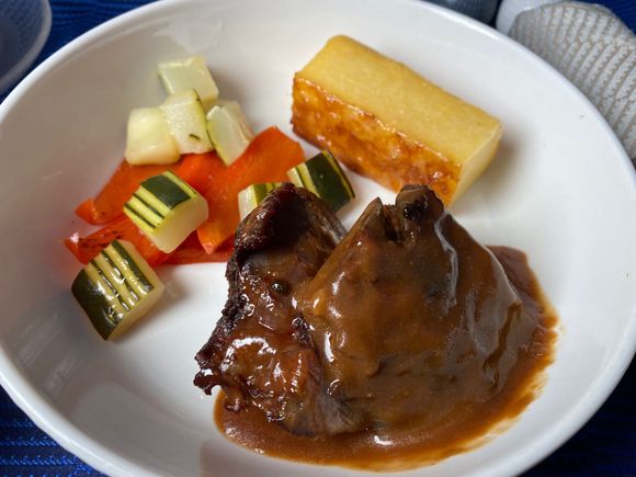 Minimalist theme continued with the entree, though all that empty space on the plate made a nice canvass for those pretty vegetable cuts. Meat was tough, polenta was dry.