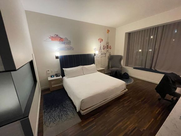 This is the bed / desk area. My understanding is that the King Deluxe room has an oversized desk and more space in between the end of the bed and the desk itself. Blinds were power controlled, which was nice. I slept well in the bed and found it very comfortable.
