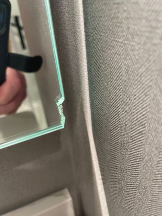 Surprised to see a chipped mirror in a brand new room!