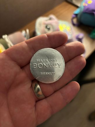A foil wrapped chocolate coin stamped with my status level at the AC Hotel New York Downtown.  It was handed to me as I checked in and thanked for my status.