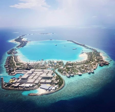 This picture was taken in Match, and it looks like there are no beach villas being built where you circled.I emailed them and asked what they were putting there and they said the white dots are cabanas. And in front of villa 311 is a storage hut for kayaks and other water equipment. 