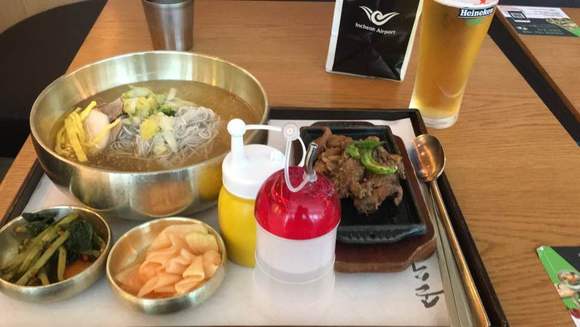 Cold Korean Noodles with a side of marinated beef bulgogi and a pint of Heineken (total circa 15,000 KRW or $15 USD)