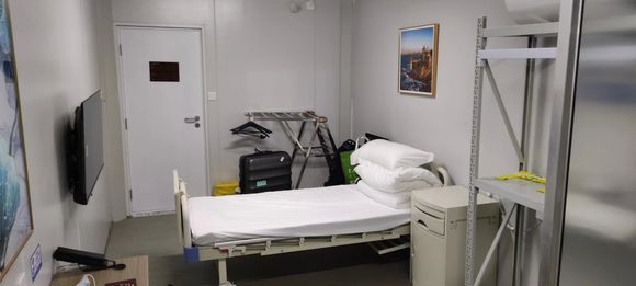 Prefab quarantine facility - room towards door