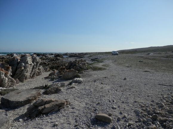 The route to the Cape Agulhas point was very gravelly. There were signs saying that we would need to proceed at our own risk. Initially, I wanted to leave our car near the visitor centre and walk to the Cape point, but then decided to drive it over, though very slowly.