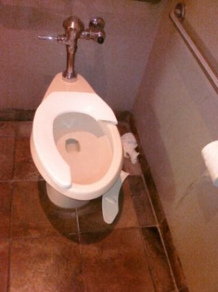 Air Canada Vancouver US Departures Lounge.  There is only one male toilet and this really is it.