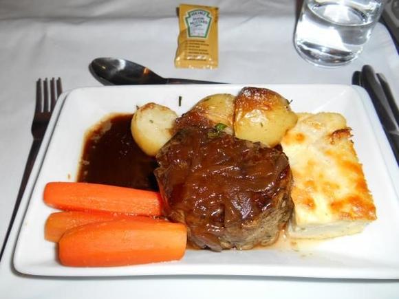 BA247/02Dec LHR-GRU, Dinner

Seared fillet of British beef with a cauliflower cheese frittata, roasted new potatoes and Port sauce