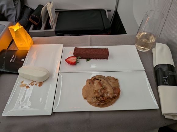 I asked for whatever desserts the very friendly cabin crew member recommended. Glad I did as the halwa was not on my radar. He pointed to the halwa as he served it and seemed genuinely excited to say that it was his favorite. It was indeed very very good. The ice cream was a bit on the frozen side but it was fantastic to mix into the warm halwa. Trifle was fine, but overshadowed by the halwa.