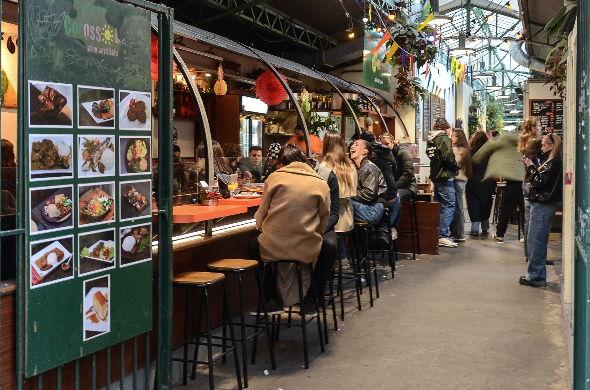 Paris famed Marche des Rouge Enfants. We hadnt been for a while but wanted to sneak it in on our final day of the trip. Our age showed when while dining there, it suddenly struck us that we were almost old enough to be grandparents to the youthful demographic. Sweet Jayzus was it ever LOUD for a Sunday afternoon. One butcher/vendor drew a curious young (i.e. 30ish) crowd as he macheted a massive beef carcass into pieces right there on a table.