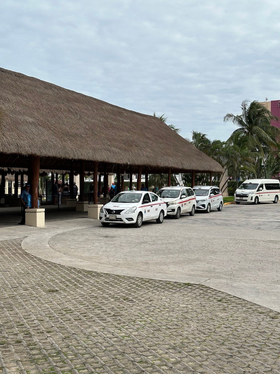 Taxis waiting at the cruise port, Puerta Maya.  The guys who rent their taxis seem to stick to the official rates, which are posted here and at the beaches...I walked away from this area and got a taxi on the street...