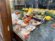 King Scallops, octopus and assorted seafood in a shop window the Cannoneggio sestiere in Venice.