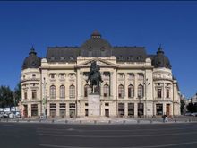 Revolutionary Square. Left to Right : Hilton Hotel ( I stayed here),Tent is Saturday Market, Dome is Concert Hall,  University Library (centre), King Carol Statue, Communist Party HQs , you can see the first floor balcony (centre of bldg.) where Ceausescu gave his last speech, was assassinated a few days later.