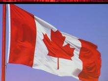  The Flag  is shown , everybody stand.