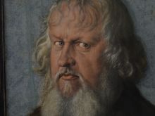 The artist painted the windows reflection in his eye. Incredible detail.