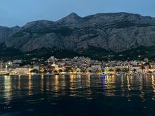 Makarska by night at the foot of Biokova  Mountain. 