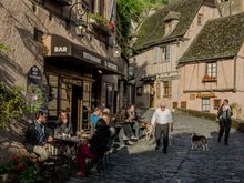 St. Jacques Cafe crowd and plump owner.