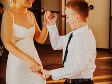 Dancing with her brother. 