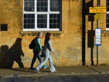 The golden hour in a gold stone town. Stone tones in the Cotswolds are warmer in the north. Buildings with the honey-coloured stone became so admired in the once-and-again affluent Cotswolds, that London's St. Paul's Cathedral was built from  local quarries.
*this shot was taken through a window. 