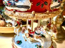  Model carousels seem to be in vogue this year. I see them all over in holiday displays. 