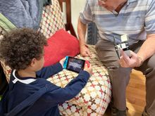 Grandad trying to fix Jays Nintendo Switch. Not successful needed a special three pronged screwdriver.