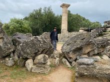 Unidentified god standing amongst the rubble of the temple 