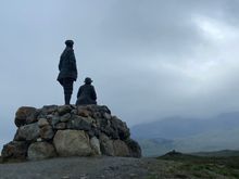Collie and Mackenzie viewing the misty mountains that they mapped 130 years ago