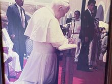 The Pope kneeling in prayer