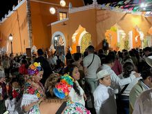 A big crowd, some seated, a lot standing