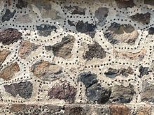 Another interesting thing I learned on the tour.  I've seen these stones between the masonary at a lot of sites.   Many of these sites have had reconstruction, and to show where the reconstruction is, the archaelogists have put in these pebbles or rocks to highlight that section