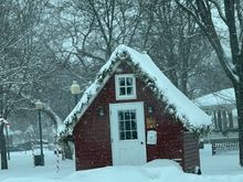 Santa has a house located in Central Park with assistance from the fire department.