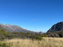 Helicopter delivering maintenance equipment 