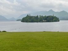 Island with a big house on it and a dock