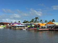 Approaching the tender docks; array of the typical shops aimed a cruisers....not as spiffy as those in other ports, but the same junky stuff for sale..skppped all that and wandered into town, which begins just after the parking lot.   Access to this area does not seem to be off limits to locals; security half hearted at best..