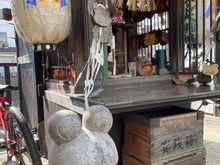 Frog statue beside a frog shrine 