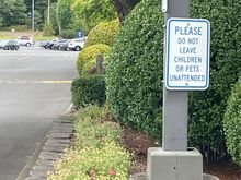 Saw this sign as we were driving out.  I can see leaving Grandma or a couple of kids in the car, but what monster would leave Fluffy the beloved family pet.